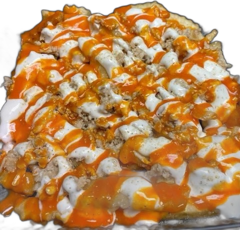 Loaded fries with chopped steak, cheese sauce and sauce drizzled over the top